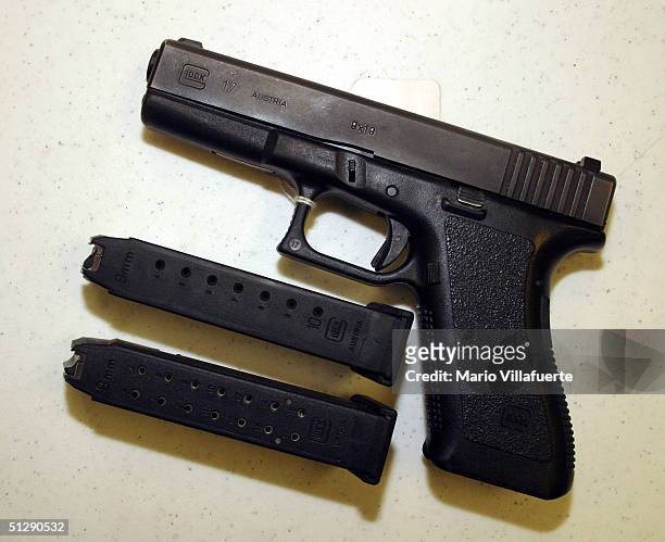 Glock 9mm pistol, legal to own under present guns laws, is displayed with 2 different capacity bullet clips at Shooters USA target range on September...