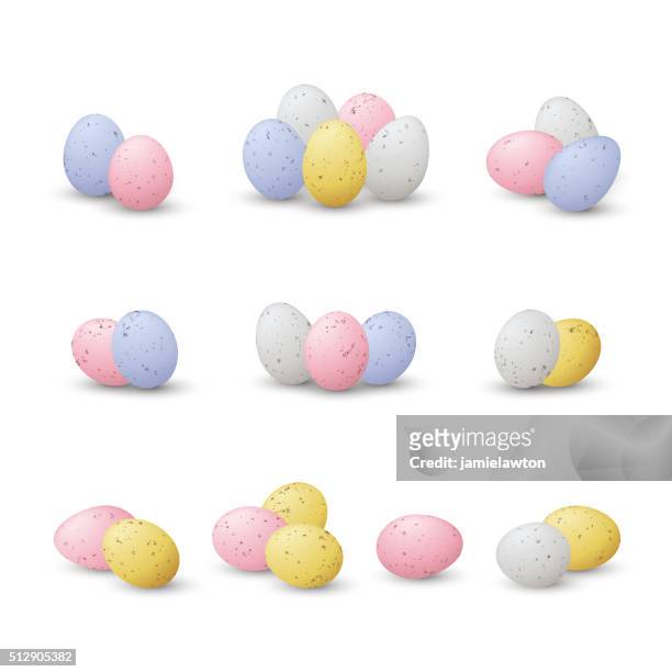 piles of mini easter eggs - spotted egg stock illustrations
