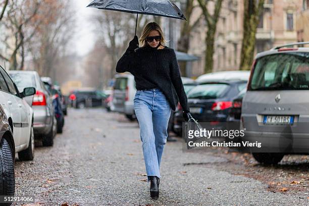 Celine Aargaard is wearing a black Sand Copenhagen wool sweater, Vetements blue denim jeans, Krogh Optikk sunglasses seen outside Marni during Milan...