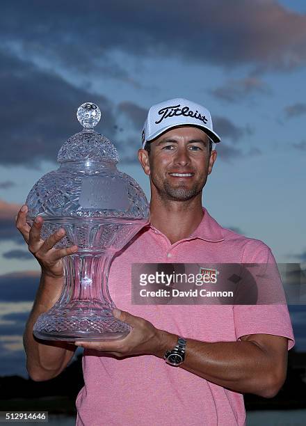 Adam Scott of Australia proudly holds the trophy after his one shot victory over Sergio Garcia during the final round of the 2016 Honda Classic held...
