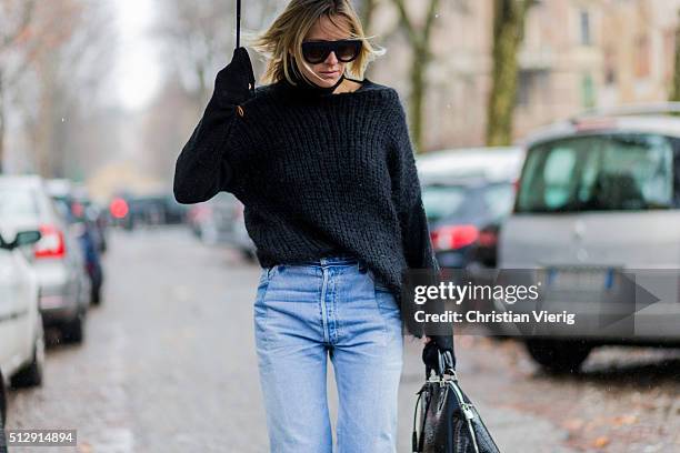 Celine Aargaard is wearing a black Sand Copenhagen wool sweater, Vetements blue denim jeans, Krogh Optikk sunglasses seen outside Marni during Milan...