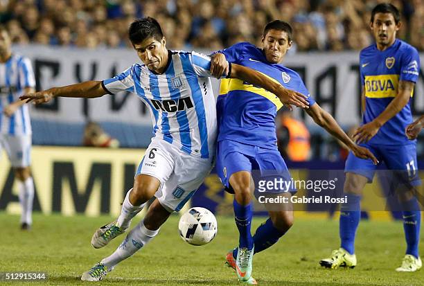 Luciano Lollo of Racing Club fights for the ball with Nahuel Molina Lucero of Boca Juniors during a fifth round match between Racing Club and Boca...
