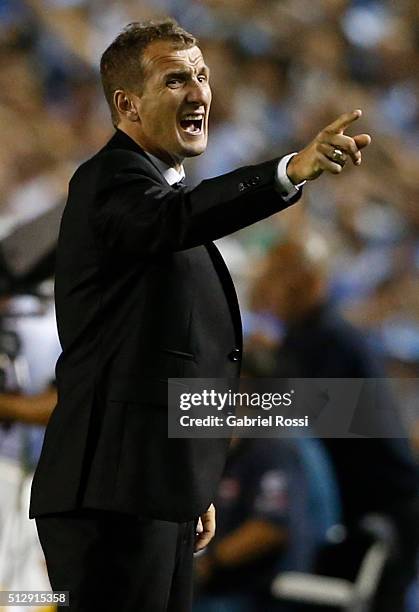 Rodolfo Arruabarrena coach of Boca Juniors gives instructions to his players during a fifth round match between Racing Club and Boca Juniors as part...