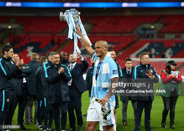 Vincent Kompany of Manchester City celebrates with the Capital One cup trophy after the Capital One Cup Final match between Liverpool and Manchester...