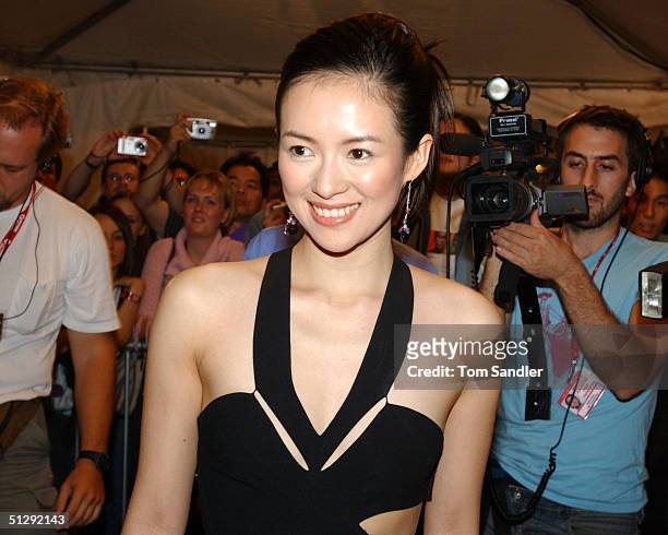 Actor Zhang Ziyi poses for the cameras on the red carpet at the North American premiere of "House of Flying Daggers" during the 29th Annual Toronto...