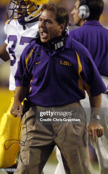 Head Coach Nick Saban of Louisiana State University calls to a player on the field against Arkansas State University on September 11, 2004 at Tiger...