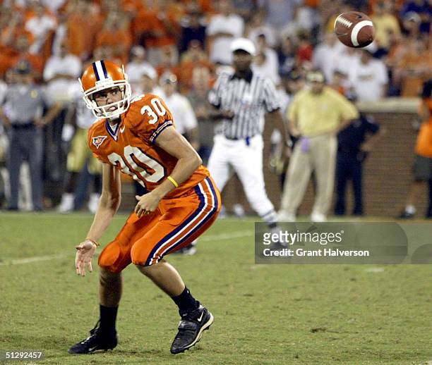 Punter Cole Chason of the Clemson University Tigers fumbles a snap on fourth down that leads to the game-winnning touchdown by the Georgia Tech...