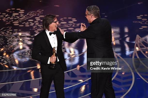 Screenwriter Charles Randolph and screenwriter-director Adam McKay accept the Best Adapted Screenplay award for 'The Big Short' onstage during the...