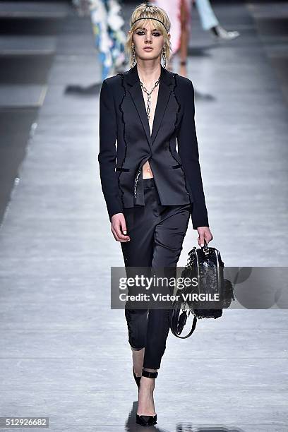 Model walks the runway at the Versace fashion show during Milan Fashion Week Fall/Winter 2016/2017 on February 26, 2016 in Milan, Italy.