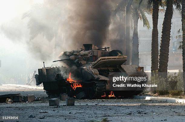 Braddley Armoured Vehicle is seen burning on September 12, 2004 in Haifa Street, Baghdad, Iraq. Fighting broke out in the early hours of September...