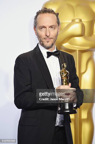 Cinematographer Emmanuel Lubezki, winner of Best Cinematography for 'The Revenant,' poses in the press room during the 88th Annual Academy Awards at...