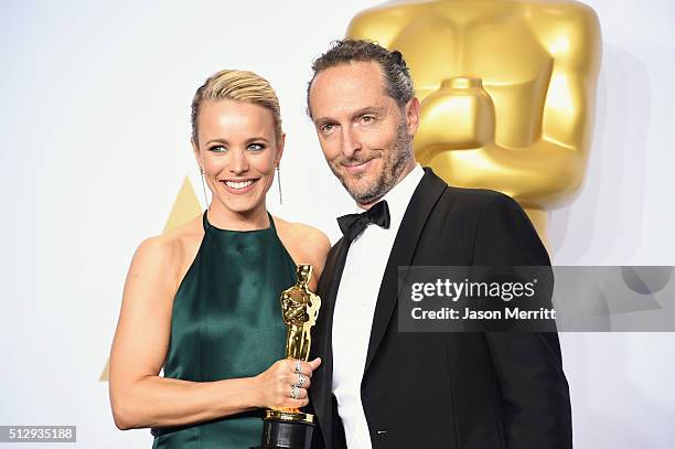 Actress Rachel McAdams and cinematographer Emmanuel Lubezki, winner of Best Cinematography for 'The Revenant,' pose in the press room during the 88th...