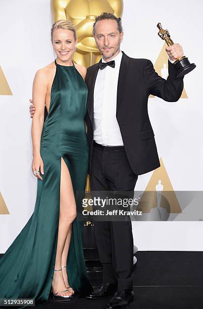 Cinematographer Emmanuel Lubezki , winner of the Best Cinematography award for "The Revenant," poses with actress Rachel McAdams in the press room...