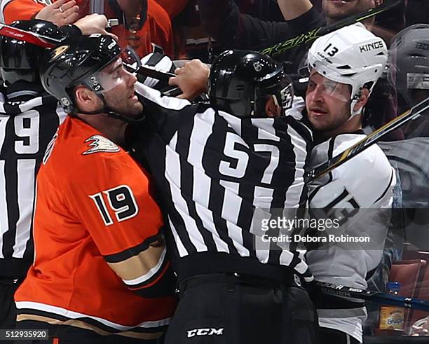 Linesman Jay Sharrers gets between Patrick Maroon of the Anaheim Ducks and Kyle Clifford of the Los Angeles Kings on February 28, 2016 at Honda...