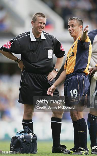 Dennis Wise of Milllwall talks with the Referee A. Bates during the Coca Cola Championship match between Ipswich Town v Millwall at Portman Road on...