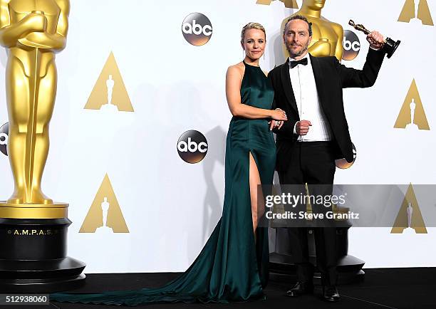 Cinematographer Emmanuel Lubezki, winner of the Best Cinematography award for 'The Revenant,' poses with actress Rachel McAdams in the press room...