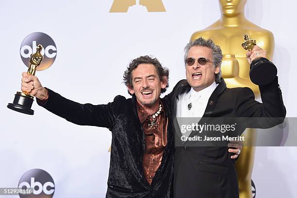 Sound editors David White and Mark A. Mangini winners of the Best Sound Editing award for 'Mad Max: Fury Road,' pose in the press room during the...