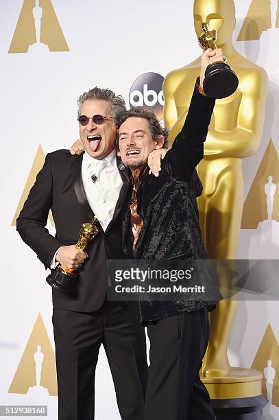 Sound editors David White and Mark A. Mangini winners of the Best Sound Editing award for 'Mad Max: Fury Road,' pose in the press room during the...