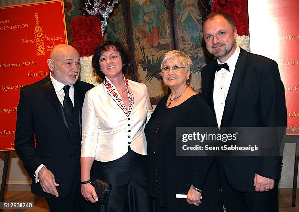 Hungarians in Hollywood hosts Bela Bunyik and wife Bonnie Bunyik pose with Hungarian Ambassador to the United States Reka Szemerkenyi and husband...