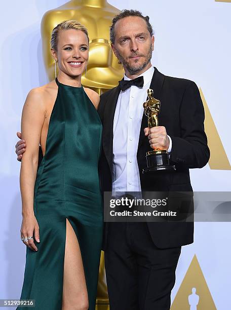 Cinematographer Emmanuel Lubezki, winner of the Best Cinematography award for 'The Revenant,' poses with actress Rachel McAdams in the press room...