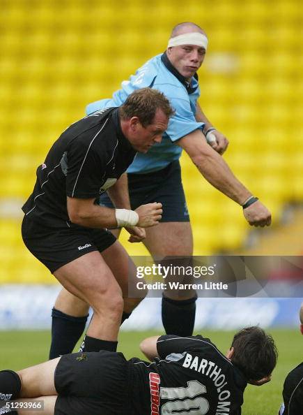 Tim Collier Tim Collier of Worcester punches out at Richard Hill of Saracens ...