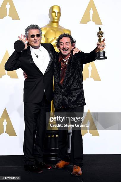Sound editors Mark A. Mangini and David White, winners of the Best Sound Editing award for 'Mad Max: Fury Road,' pose in the press room during the...