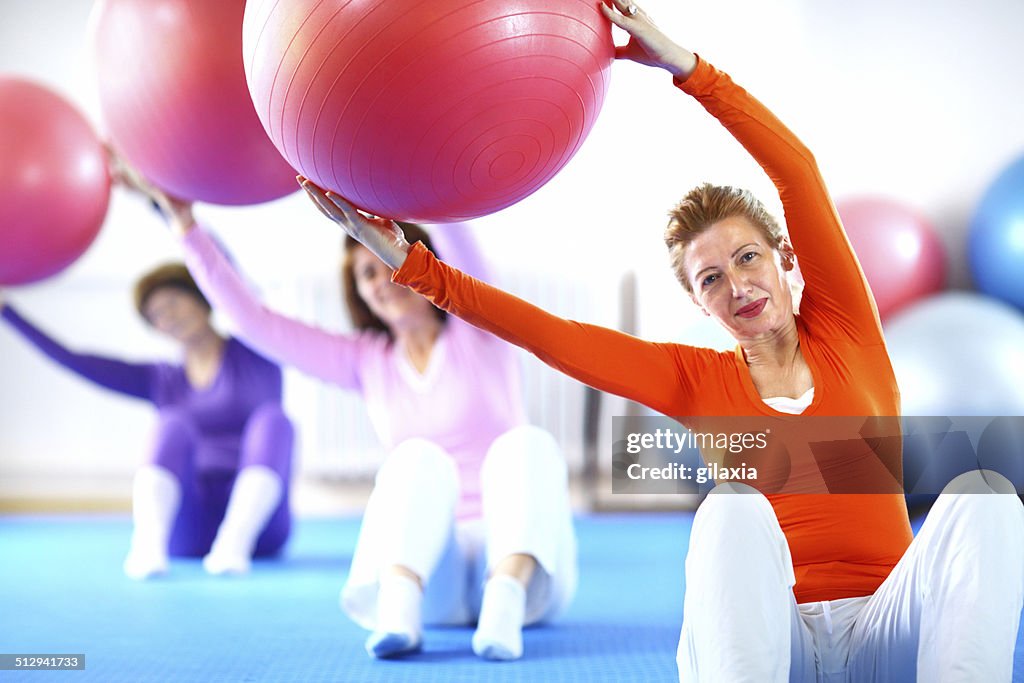 Senior women doing Pilates.