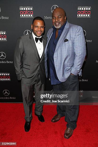 Anthony Anderson and Gil Robertson arrive at the Mercedes-Benz and African American Film Critics Association Oscar viewing party at Four Seasons...