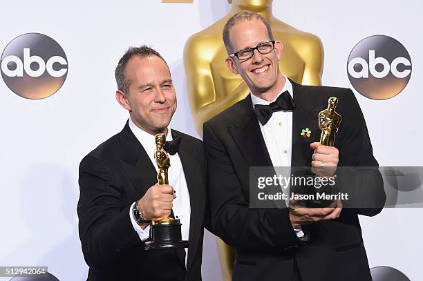 Producer Jonas Rivera and director Pete Docter winners of the Best Animated Feature Film award for 'Inside Out' pose in the press room during the...