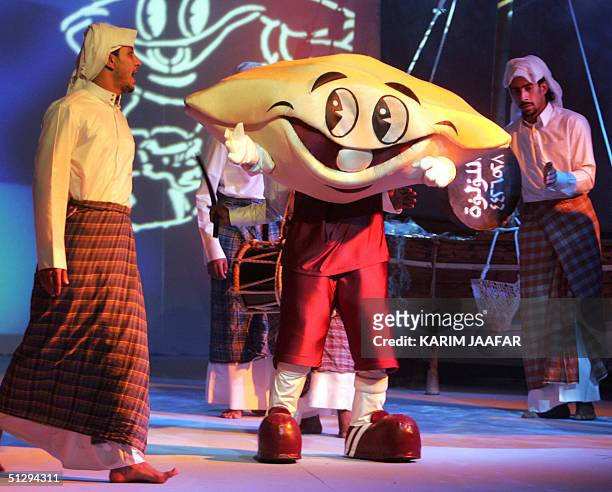 The mascot of the 17th Gulf Cup soccer tournament hosted by Qatar from 10 to 24 December is presented on stage during the drawing ceremony in Doha 12...