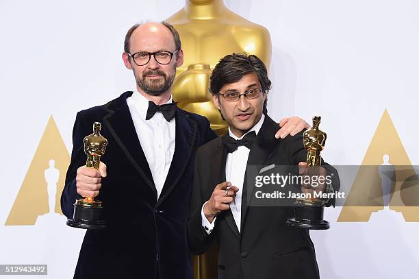 Filmmakers James Gay-Rees and Asif Kapadia winners of the Best Documentary Feature award for 'Amy' pose in the press room during the 88th Annual...