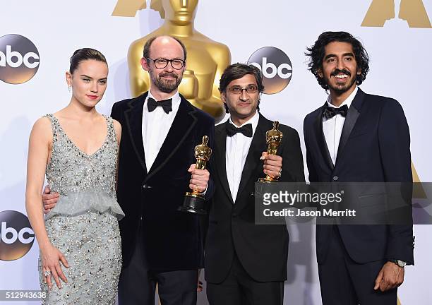Actress Daisy Ridley, filmmakers James Gay-Rees, Asif Kapadia winners of the Best Documentary Feature award for 'Amy,' and Dev Patel pose in the...