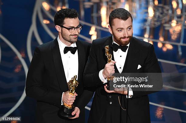 Songwriter Jimmy Napes and singer-songwriter Sam Smith accept the Best Original Song award for 'Writing's on the Wall' from 'Spectre' onstage during...