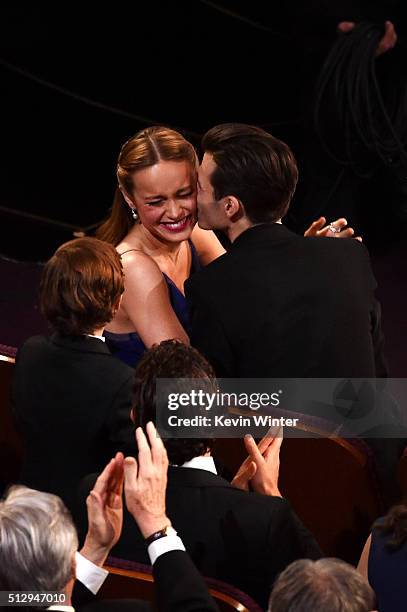 Musician Alex Greenwald kisses actress Brie Larson after she wins the Best Actress award for 'Room' during the 88th Annual Academy Awards at the...