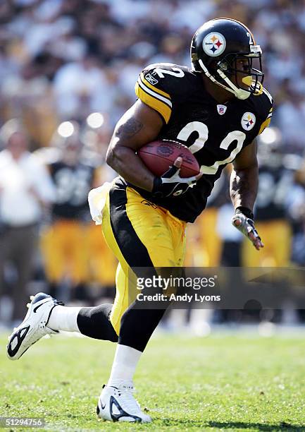Duce Staley of the Pittsburgh Steelers runs the ball against the Oakland Raiders on September 12, 2004 at Heinz Field in Pittsburgh, Pennsylvania....