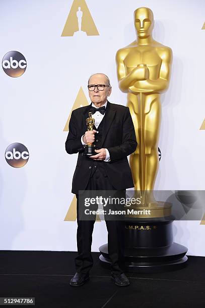 Composer Ennio Morricone winner of the Best Original Score award for ''The Hateful Eight' poses in the press room during the 88th Annual Academy...