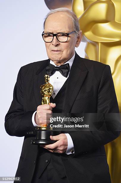 Composer Ennio Morricone winner of the Best Original Score award for ''The Hateful Eight' poses in the press room during the 88th Annual Academy...