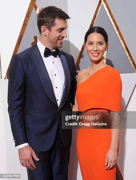 Actress Olivia Munn and NFL player Aaron Rodgers arrive at the 88th Annual Academy Awards at Hollywood & Highland Center on February 28, 2016 in...