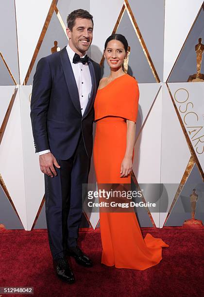 Actress Olivia Munn and NFL player Aaron Rodgers arrive at the 88th Annual Academy Awards at Hollywood & Highland Center on February 28, 2016 in...