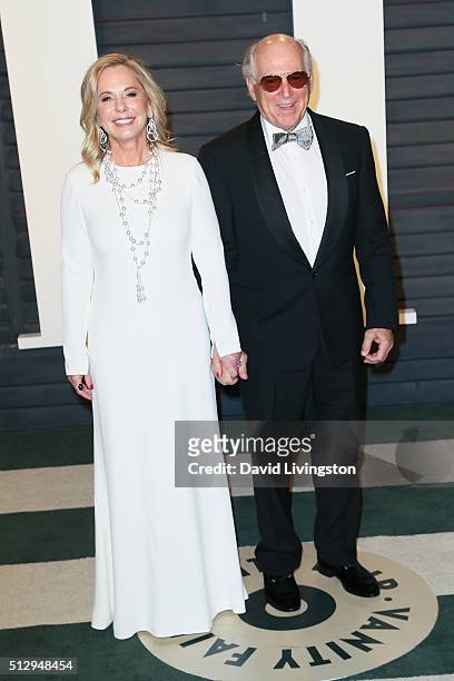 Musician Jimmy Buffett and Jane Slagsvol arrive at the 2016 Vanity Fair Oscar Party Hosted by Graydon Carter at the Wallis Annenberg Center for the...