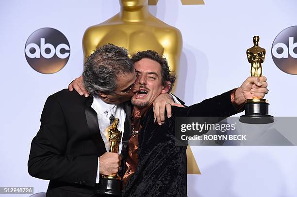 Mark Mangini and David White pose with their Oscar for Best Sound Editing, "Mad Max: Fury Road," in the press room during the 88th Oscars in...