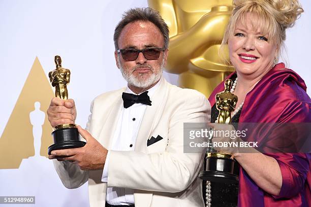 Colin Gibson and Lisa Thompson pose with their Oscar for Best Production Design, "Mad Max: Fury Road," in the press room during the 88th Oscars in...