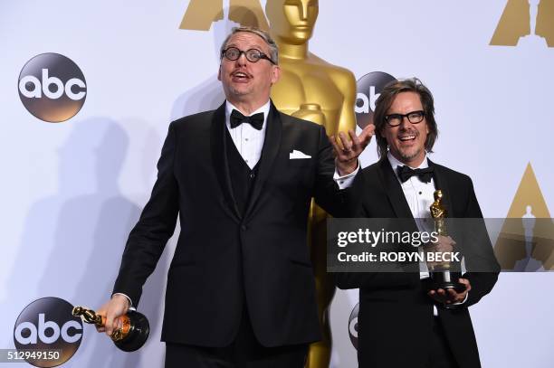 Adam McKay and Charles Randolph pose with their trophies for "The Big Short" in the press room during the 88th Oscars in Hollywood on February 28,...