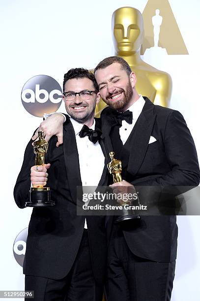 Songwriter Jimmy Napes and singer-songwriter Sam Smith, winners of the Best Original Song award for 'Writing's on the Wall' from 'Spectre,' pose in...
