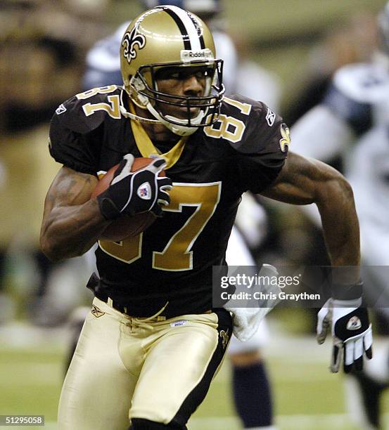 Joe Horn of the New Orleans Saints completes a 33 yard reception against the Seattle Seahawks September 12 at the Superdome in New Orleans,...