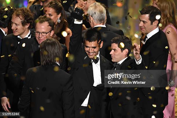 Oscar winners including filmmakers Gabriel Osorio Vargas, Pato Escala Pierart, Laszlo Nemes, Tom McCarthy, and Josh Singer celebrate onstage during...