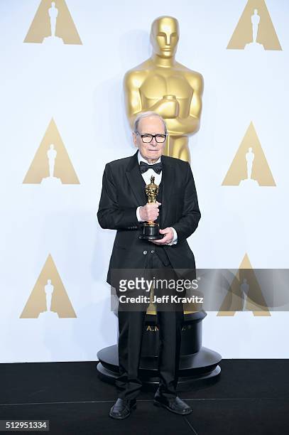 Composer Ennio Morricone, winner of the Best Original Score award for ''The Hateful Eight,' poses in the press room during the 88th Annual Academy...