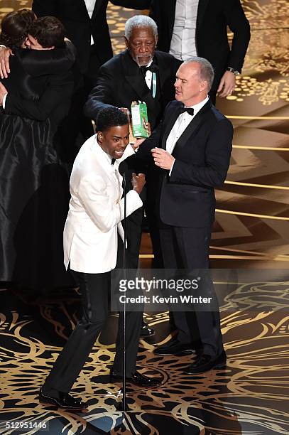 Host Chris Rock, actors Morgan Freeman and Michael Keaton celebrate onstage during the 88th Annual Academy Awards at the Dolby Theatre on February...