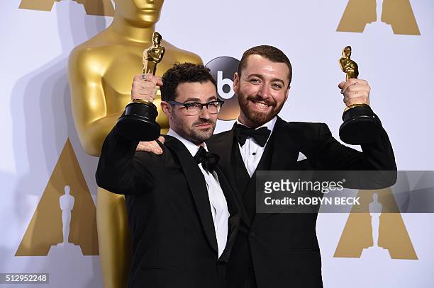 Jimmy Napes and Sam Smith pose with the Oscar for Best Original Song, "Writing's on the Wall" from "Spectre," in the press room during the 88th...