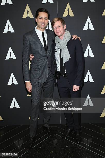 Chief Curator of the Department of Film at the Museum of Modern Art, Raj Roy and guest attend the Oscar Night New York Viewing Party Hosted By The...